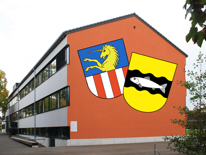 Bild: Schulhaus Grüze mit den Wappen von Dübendorf & Schwerzenbach (Roland zh, wikimedia commons, CC BY-SA 3.0)